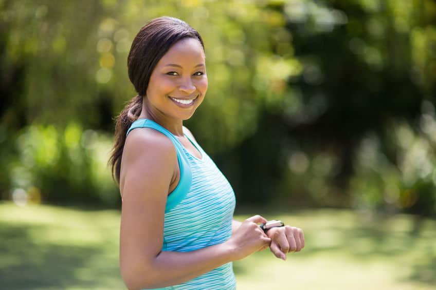 A woman jogging outside on a sunny day